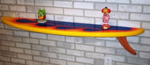 surfboard-wall-shelf-items-on-it